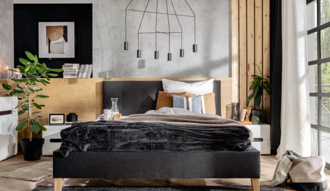 Betonowa ściana w sypialni – jak uzyskać efekt dekoracyjny i ożywić aranżację wnętrza?
